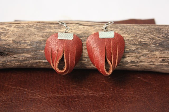 Heart-shaped red leather drop earrings with a brushed metal cap