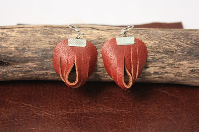 Red leather petal-shaped drop earrings with an open teardrop cutout